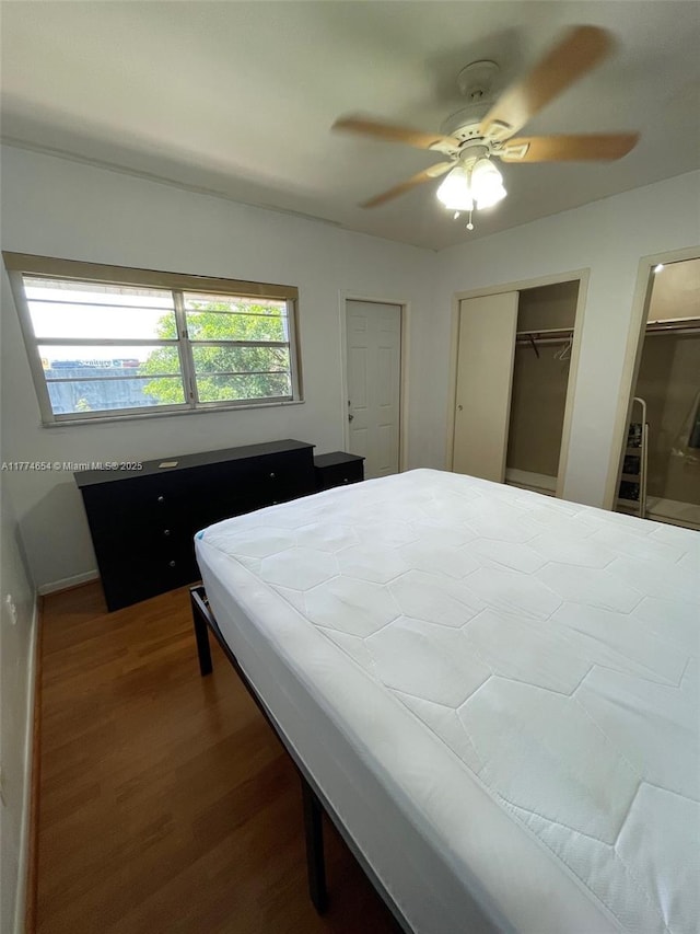 230 SW 11th Ave Unit 15, Hallandale Beach, FL 33009 - bedroom with wood finished floors, two closets, and ceiling fan