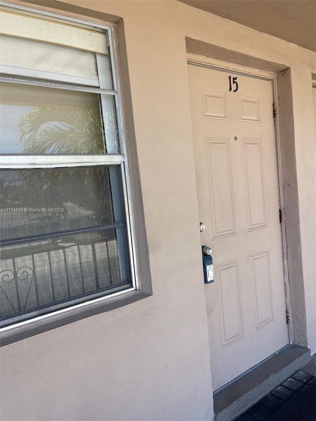 230 SW 11th Ave Unit 15, Hallandale Beach, FL 33009 - view of exterior entry with stucco siding