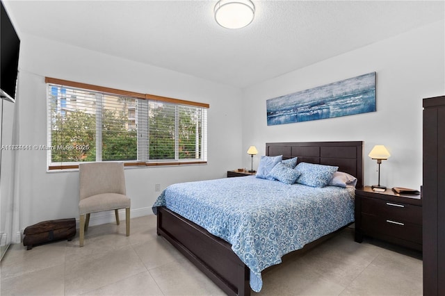 bedroom with light tile patterned flooring