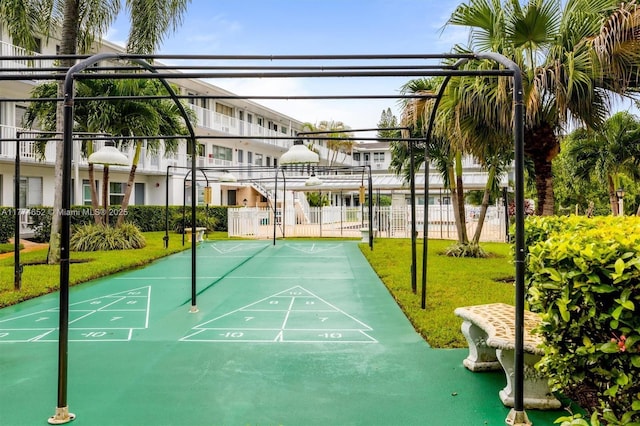 15610 NE 6th Ave Unit 32C, Miami, FL 33162 - view of home's community featuring fence, a yard, and shuffleboard