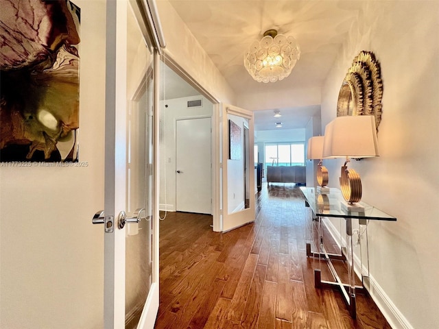 1850 S Ocean Dr Unit 1004, Hallandale Beach, FL 33009 - corridor with baseboards, wood finished floors, and visible vents