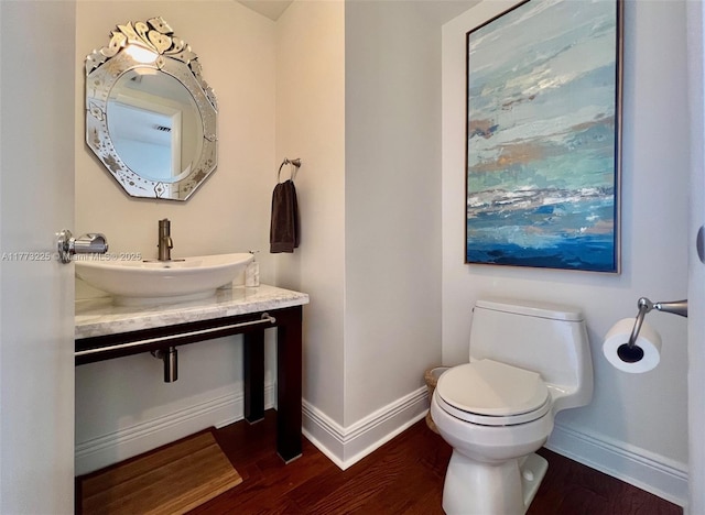 1850 S Ocean Dr Unit 1004, Hallandale Beach, FL 33009 - half bath featuring baseboards, toilet, and wood finished floors
