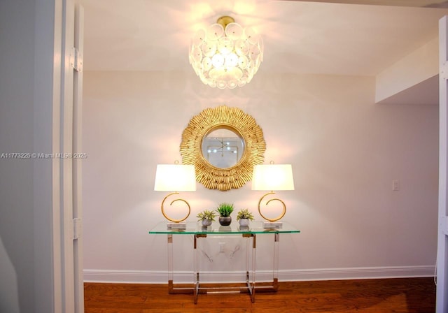 1850 S Ocean Dr Unit 1004, Hallandale Beach, FL 33009 - corridor featuring baseboards, a notable chandelier, and wood finished floors