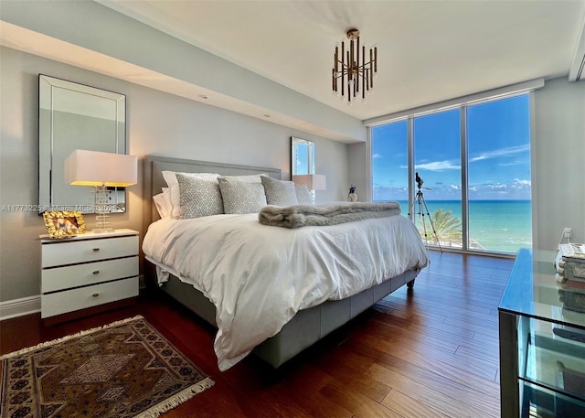 1850 S Ocean Dr Unit 1004, Hallandale Beach, FL 33009 - bedroom with a water view, dark wood finished floors, baseboards, a wall of windows, and access to outside