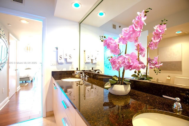 1850 S Ocean Dr Unit 1004, Hallandale Beach, FL 33009 - ensuite bathroom featuring recessed lighting, double vanity, visible vents, and a sink