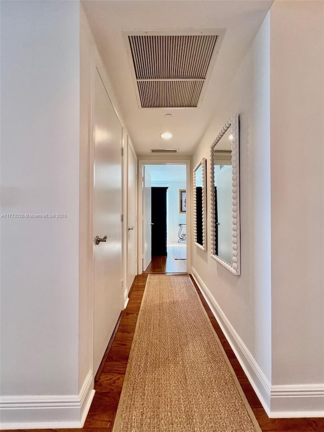 1850 S Ocean Dr Unit 1004, Hallandale Beach, FL 33009 - hallway featuring baseboards, dark wood-type flooring, and visible vents