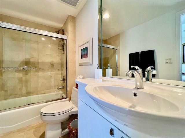 1850 S Ocean Dr Unit 1004, Hallandale Beach, FL 33009 - bathroom with tile patterned flooring, combined bath / shower with glass door, visible vents, toilet, and vanity