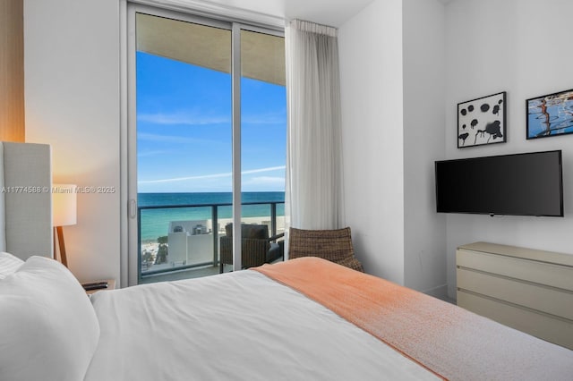 bedroom featuring expansive windows