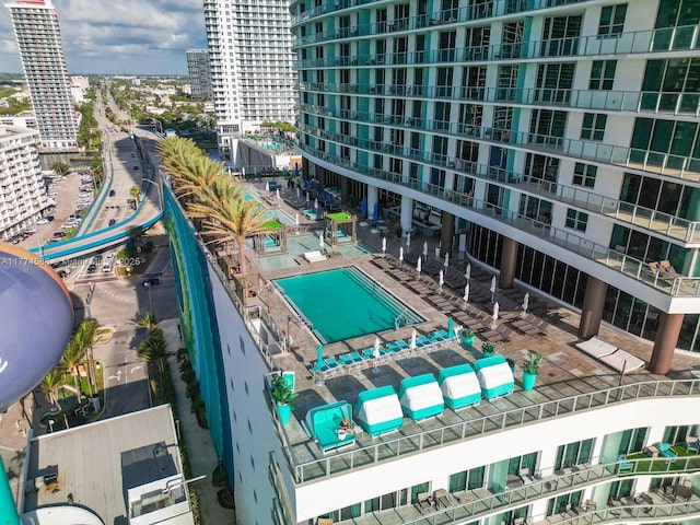 view of pool featuring a view of city
