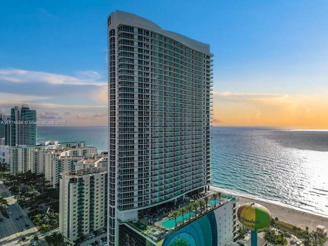 exterior space featuring a water view and a view of city