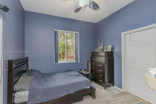 bedroom featuring light wood-style floors and ceiling fan