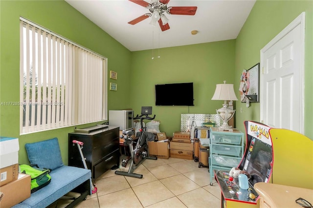 playroom with a ceiling fan and tile patterned flooring