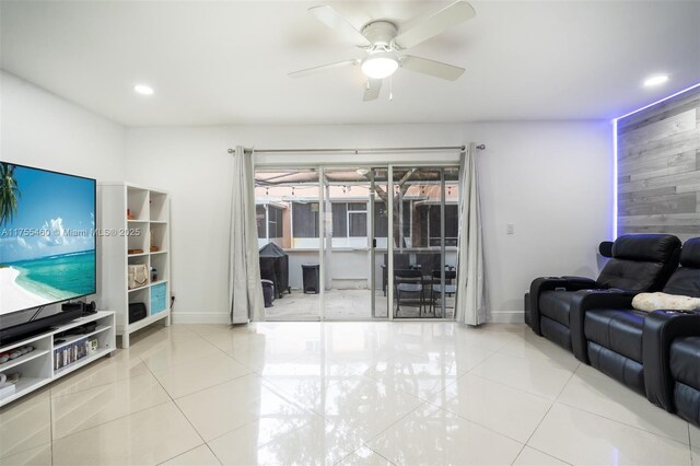 living area featuring recessed lighting, tile patterned flooring, baseboards, and a ceiling fan