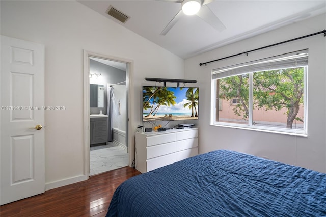bedroom with baseboards, vaulted ceiling, a ceiling fan, visible vents, and wood finished floors