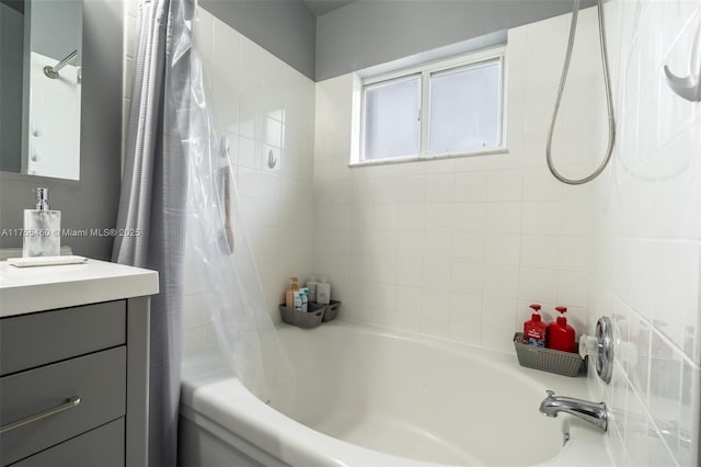 full bathroom featuring vanity and shower / bath combination with curtain