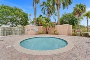 view of pool with fence
