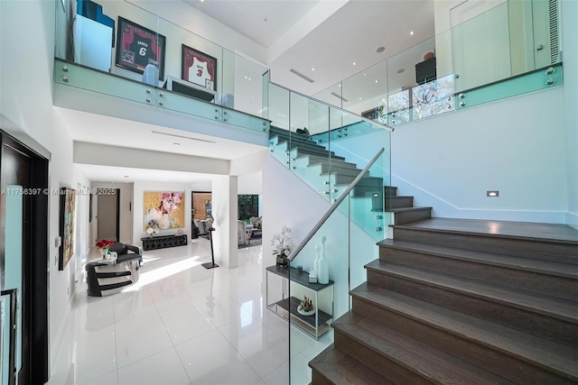 7360 SW 53rd Pl, Miami, FL 33143 - staircase featuring a high ceiling