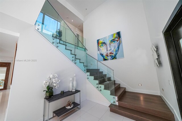 7360 SW 53rd Pl, Miami, FL 33143 - kitchen featuring modern cabinets, white cabinetry, light tile patterned flooring, and stainless steel appliances