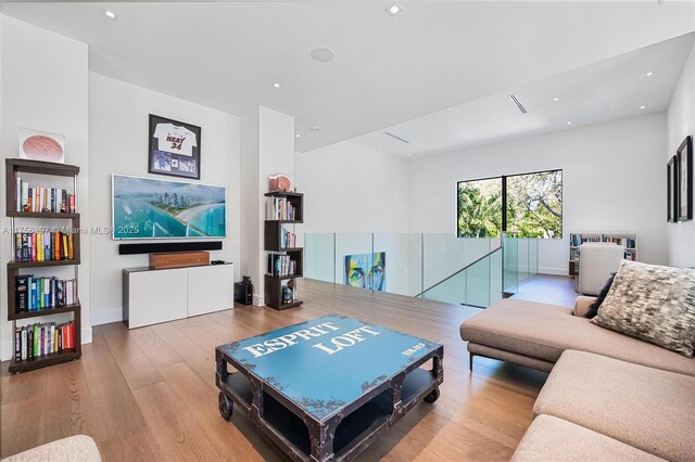 7360 SW 53rd Pl, Miami, FL 33143 - living area featuring baseboards, wood finished floors, and recessed lighting
