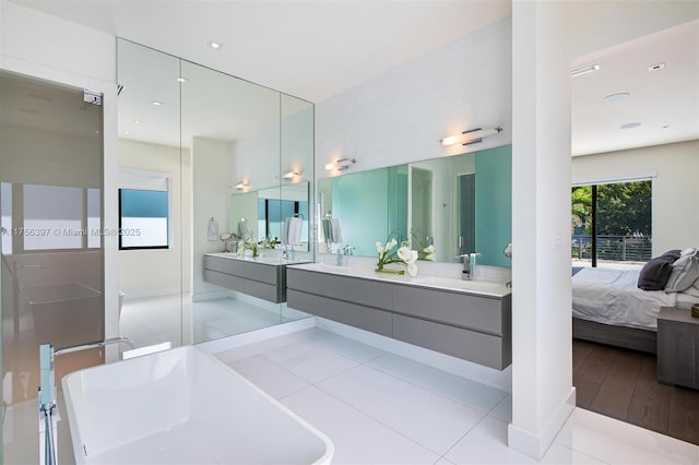 7360 SW 53rd Pl, Miami, FL 33143 - full bath featuring tile patterned flooring, a soaking tub, a sink, ensuite bath, and double vanity