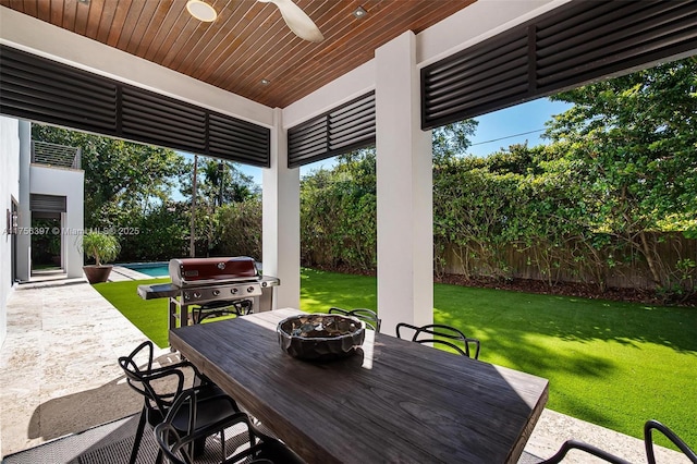 7360 SW 53rd Pl, Miami, FL 33143 - view of patio featuring fence, a grill, an outdoor fire pit, outdoor dining area, and a ceiling fan