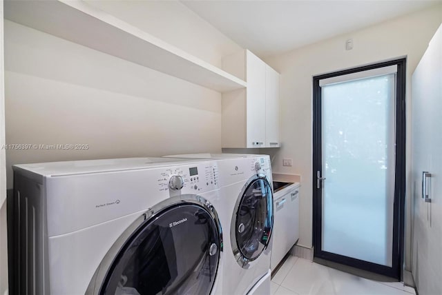7360 SW 53rd Pl, Miami, FL 33143 - laundry area with light tile patterned flooring, washing machine and dryer, and cabinet space