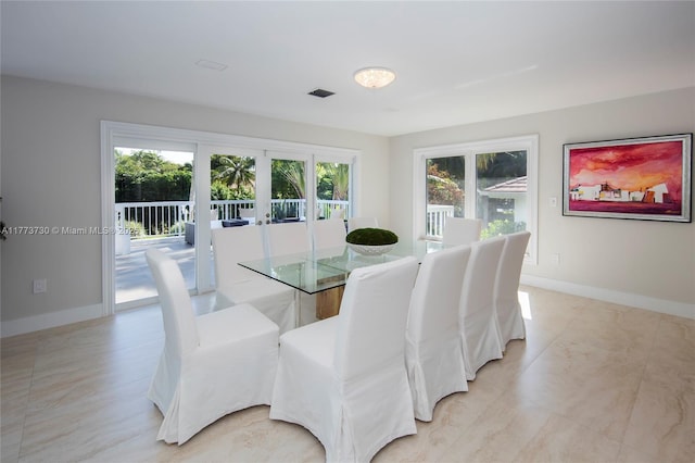 413 Santurce Ave, Coral Gables, FL 33143 - dining area with french doors, visible vents, and baseboards