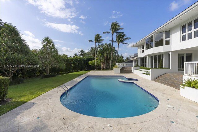 413 Santurce Ave, Coral Gables, FL 33143 - outdoor pool featuring a patio area and a lawn