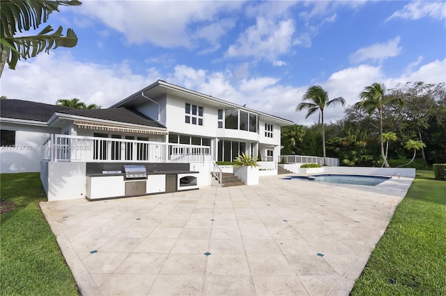 413 Santurce Ave, Coral Gables, FL 33143 - back of house featuring a patio, an outdoor pool, stucco siding, and an outdoor kitchen