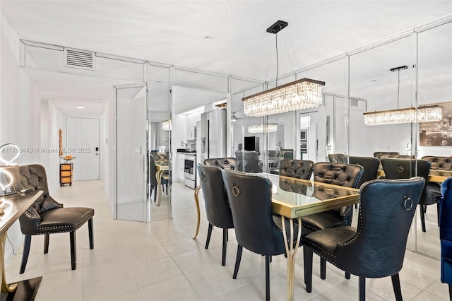 901 SW 141st Ave Unit 409M, Pembroke Pines, FL 33027 - dining room featuring a chandelier and light tile patterned floors