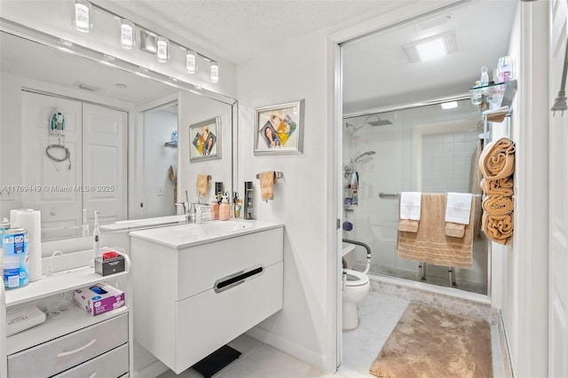 901 SW 141st Ave Unit 409M, Pembroke Pines, FL 33027 - full bath featuring a shower stall, toilet, vanity, and a textured ceiling