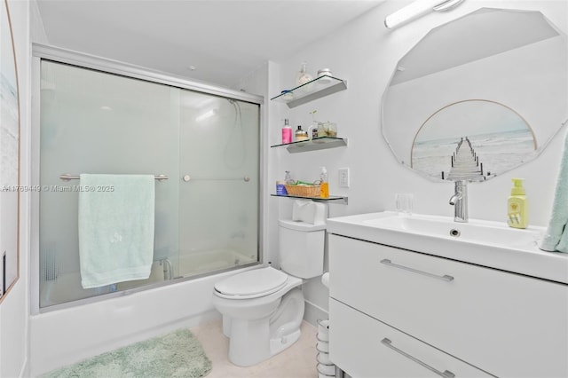 901 SW 141st Ave Unit 409M, Pembroke Pines, FL 33027 - bathroom with toilet, bath / shower combo with glass door, vanity, and tile patterned flooring