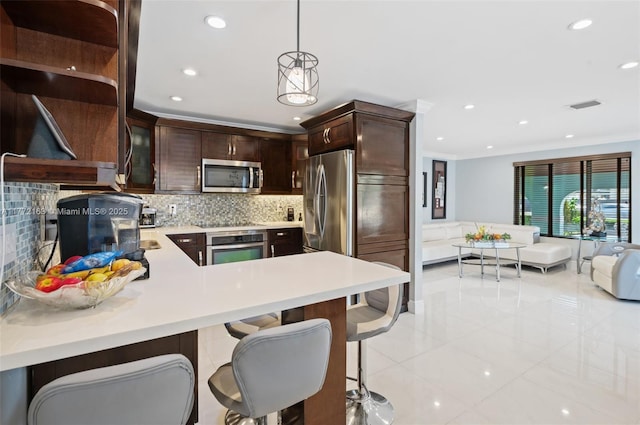 kitchen with light tile patterned floors, light countertops, appliances with stainless steel finishes, dark brown cabinets, and recessed lighting