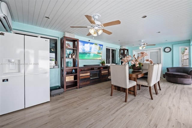 dining space featuring ceiling fan, wooden ceiling, and wood finished floors