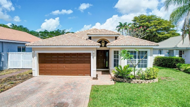 16249 NW 24th St, Pembroke Pines, FL 33028 - mediterranean / spanish home featuring a garage, stucco siding, a tiled roof, and driveway