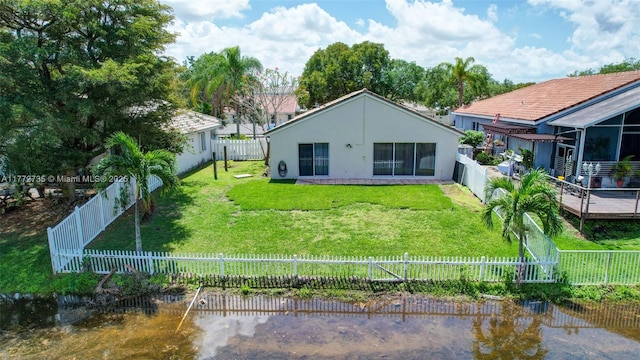 16249 NW 24th St, Pembroke Pines, FL 33028 - back of house featuring a fenced backyard, stucco siding, and a water view