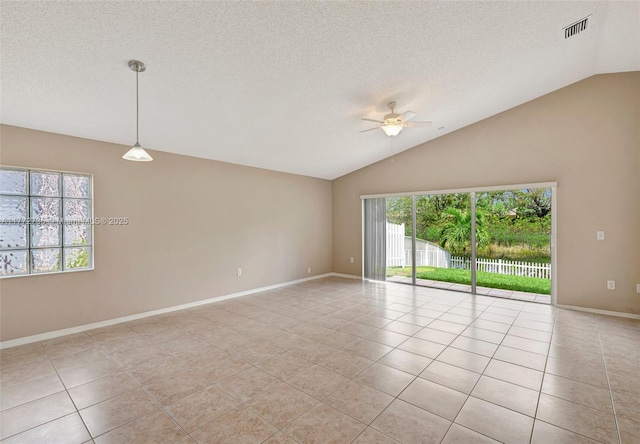 16249 NW 24th St, Pembroke Pines, FL 33028 - spare room with vaulted ceiling, light tile patterned flooring, a ceiling fan, healthy amount of natural light, and a textured ceiling