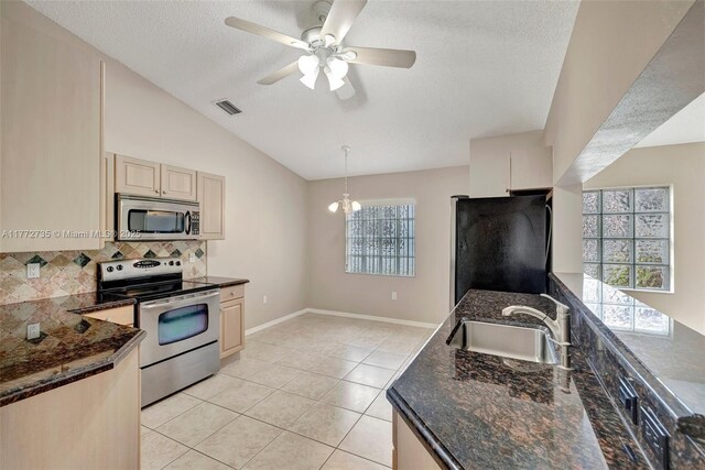 16249 NW 24th St, Pembroke Pines, FL 33028 - kitchen featuring stainless steel appliances, backsplash, a textured ceiling, a ceiling fan, and lofted ceiling