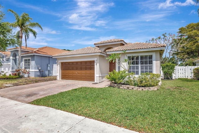 16249 NW 24th St, Pembroke Pines, FL 33028 - mediterranean / spanish house with stucco siding, a tiled roof, driveway, and a garage