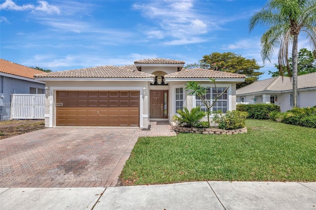 16249 NW 24th St, Pembroke Pines, FL 33028 - mediterranean / spanish-style home with decorative driveway, stucco siding, an attached garage, a front lawn, and a tile roof