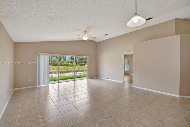 16249 NW 24th St, Pembroke Pines, FL 33028 - unfurnished room with a textured ceiling, vaulted ceiling, light tile patterned floors, and ceiling fan