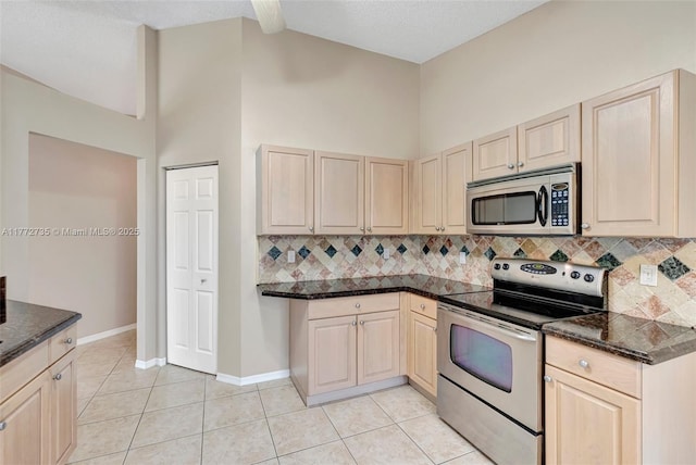 16249 NW 24th St, Pembroke Pines, FL 33028 - kitchen featuring appliances with stainless steel finishes, backsplash, light brown cabinets, and light tile patterned floors