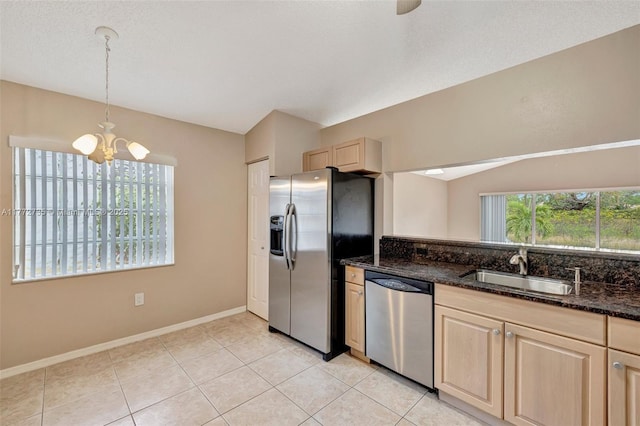 16249 NW 24th St, Pembroke Pines, FL 33028 - kitchen with appliances with stainless steel finishes, a chandelier, hanging light fixtures, dark stone countertops, and light brown cabinetry