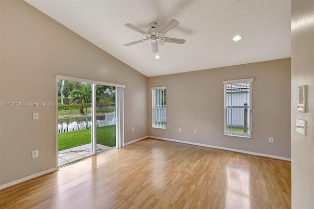 16249 NW 24th St, Pembroke Pines, FL 33028 - spare room featuring a textured ceiling, wood finished floors, ceiling fan, recessed lighting, and a water view