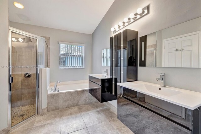 16249 NW 24th St, Pembroke Pines, FL 33028 - full bathroom with a bath, a stall shower, two vanities, and tile patterned floors