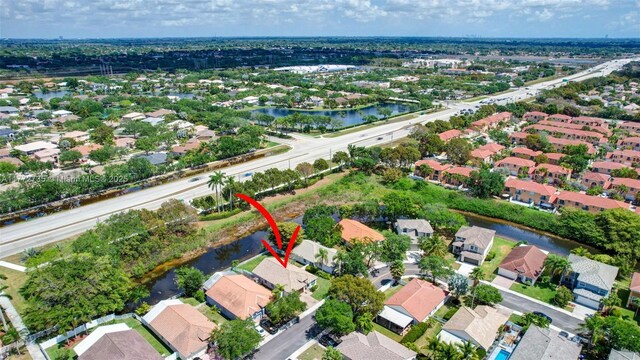 16249 NW 24th St, Pembroke Pines, FL 33028 - aerial view of property and surrounding area featuring a nearby body of water and nearby suburban area