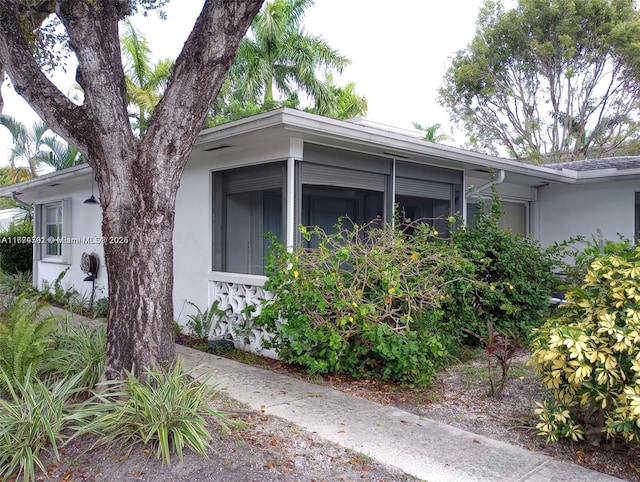 view of home's exterior with stucco siding