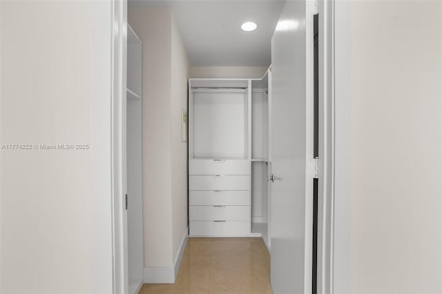 corridor with baseboards and recessed lighting