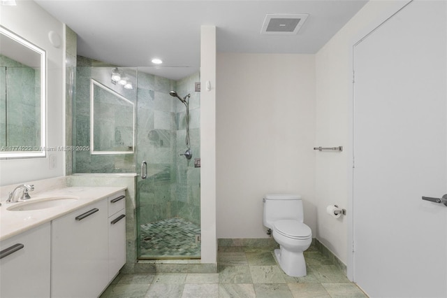 bathroom featuring visible vents, baseboards, toilet, vanity, and a stall shower