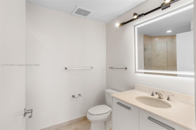 full bathroom with tile patterned flooring, vanity, toilet, visible vents, and tiled shower